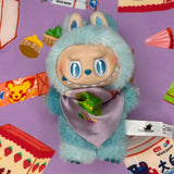 Plush toy labubu with a bandana surrounded by colorful packaging on a purple background